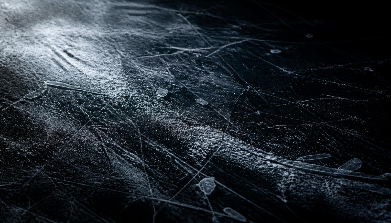 Scarred ice surface under low light